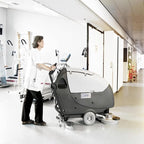 Gray and white nilfisk scheuersaugmaschine ba 651 with digital display panel and charger for industrial floor cleaning