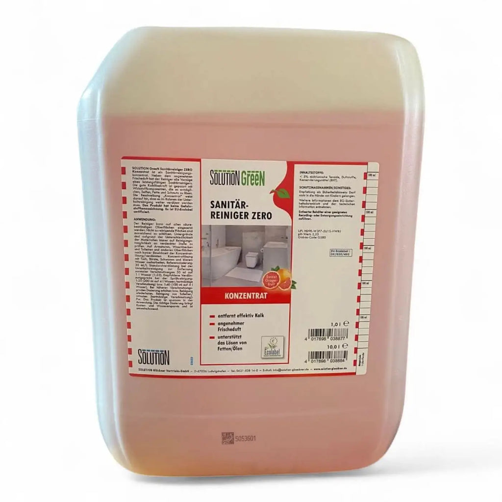 Ein durchsichtiger pinkfarbener kunststoffbehälter mit sanitärreiniger zero von solution green etikett in rot und grün