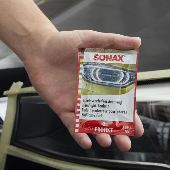 Sonax profiline scheinwerfer aufbereitungsset 26-teilig mit rot weißer kopfdichtmittel verpackung und mehrsprachiger beschriftung